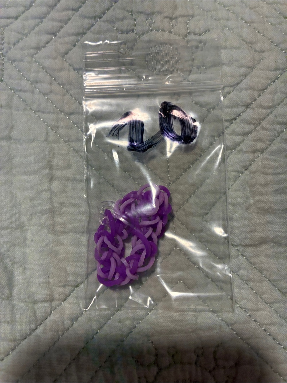 Purple elastic rainbow loom bracelet